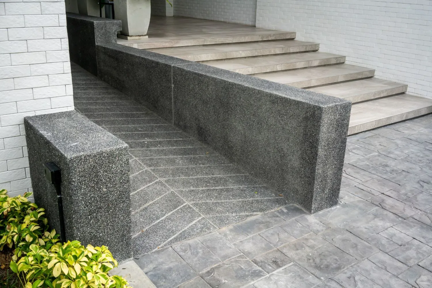 Concrete access ramp built to grade